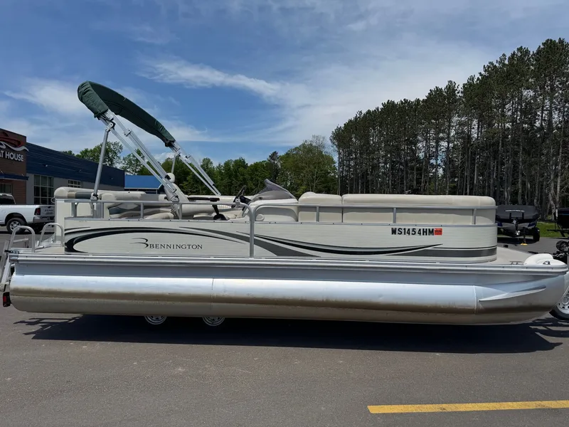 Slide: The Image of 2007 Bennington 2250RL pontoon boat in parking lot, sunny day. - 2