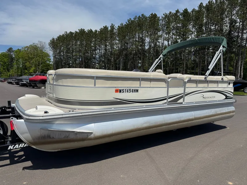 Slide: The Image of 2007 Bennington 2250RL pontoon boat parked outdoors. - 3