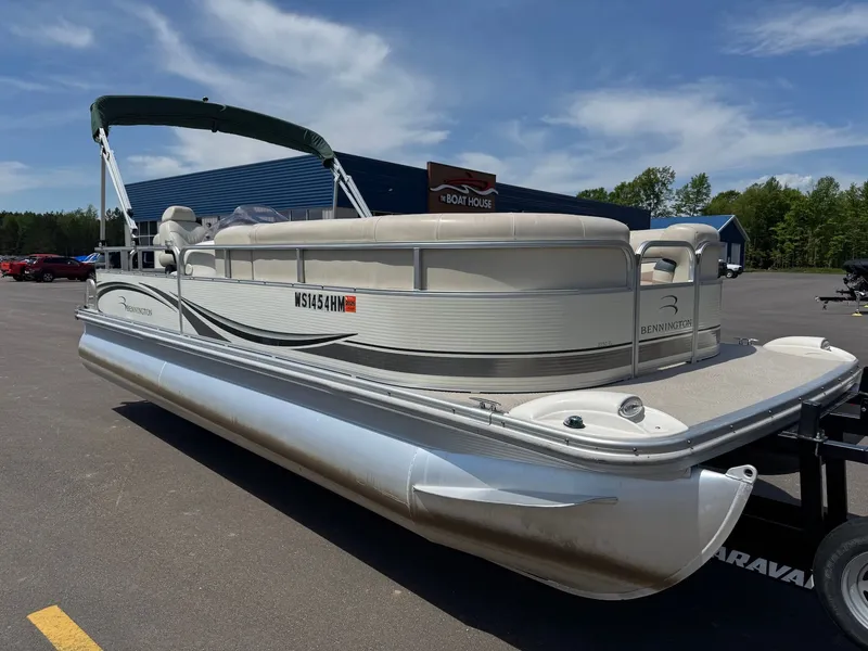 Slide: The Image of 2007 Bennington 2250RL pontoon boat on a trailer outdoors. - 4