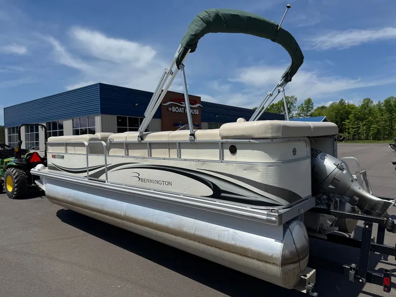 Slide: The Image of 2007 Bennington 2250RL pontoon boat parked outside a building. - 5