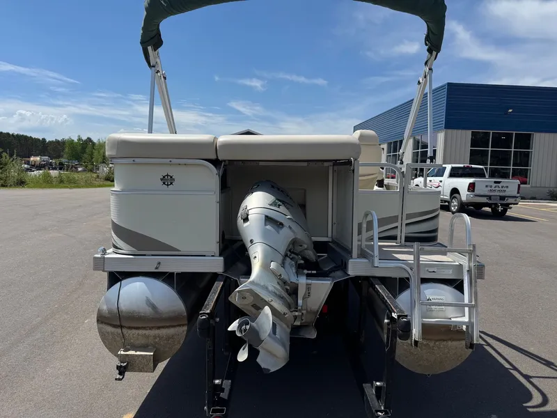 Slide: The Image of 2007 Bennington 2250RL pontoon boat with outboard motor on parking lot. - 7