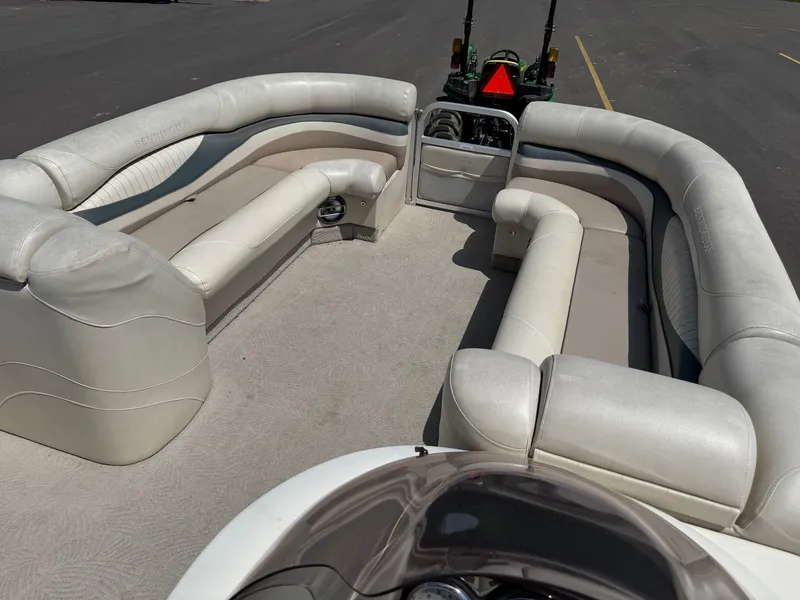 Slide: The Image of Interior of a 2007 Bennington 2250RL pontoon boat with beige seating. - 9