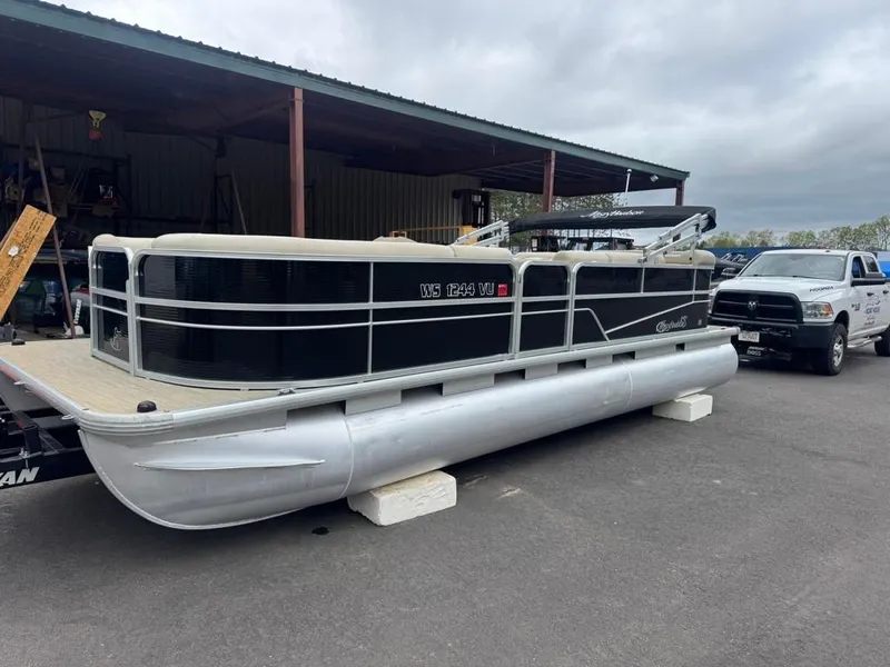 Slide: The Image of 2019 Misty Harbor A2285CR Adventure pontoon boat in parking lot. - 2