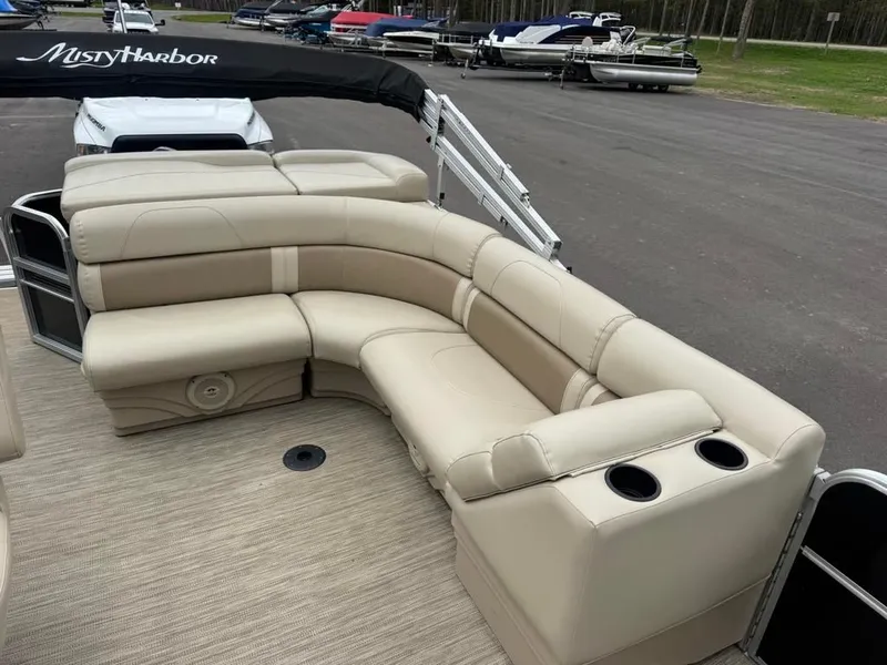 Slide: The Image of 2019 Misty Harbor A2285CR Adventure pontoon boat with beige seating. - 24