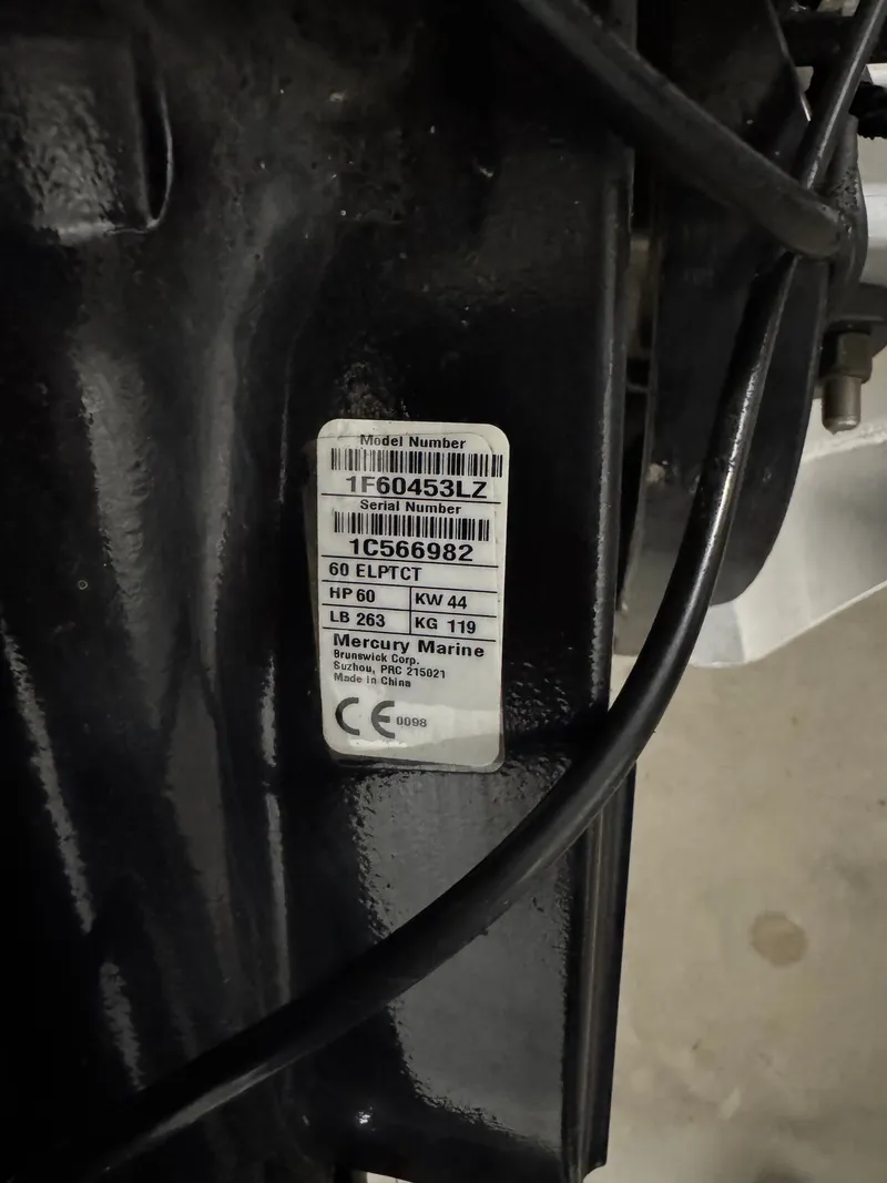 Slide: The Image of Mercury Marine engine label with model and serial number. - 35