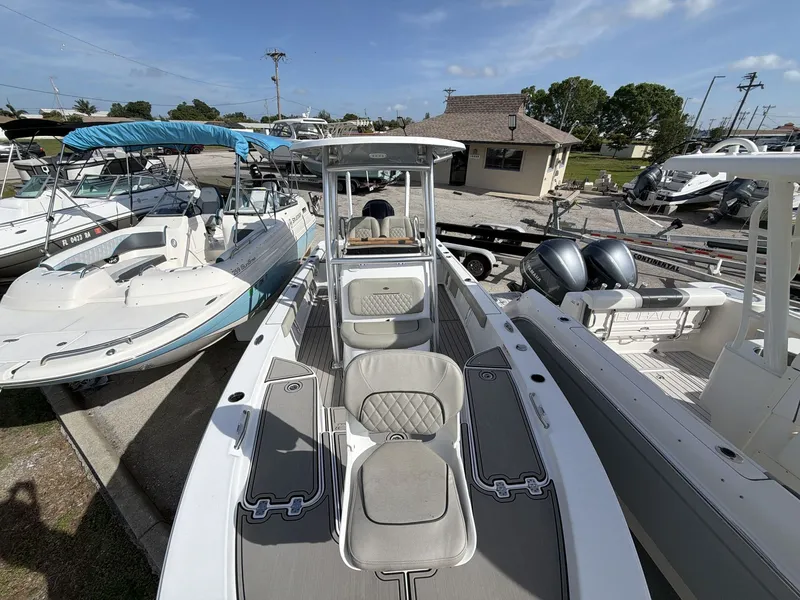 Slide: The Image of 2024 Sportsman Masters 227 Bay Boat docked, featuring modern amenities. - 10