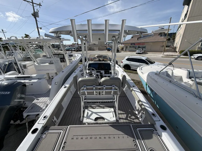 Slide: The Image of 2024 Sportsman Masters 227 Bay Boat on a parking lot. - 11