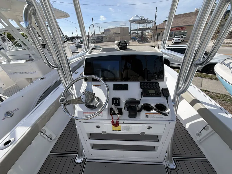 Slide: The Image of 2024 Sportsman Masters 227 Bay Boat helm with modern controls. - 12