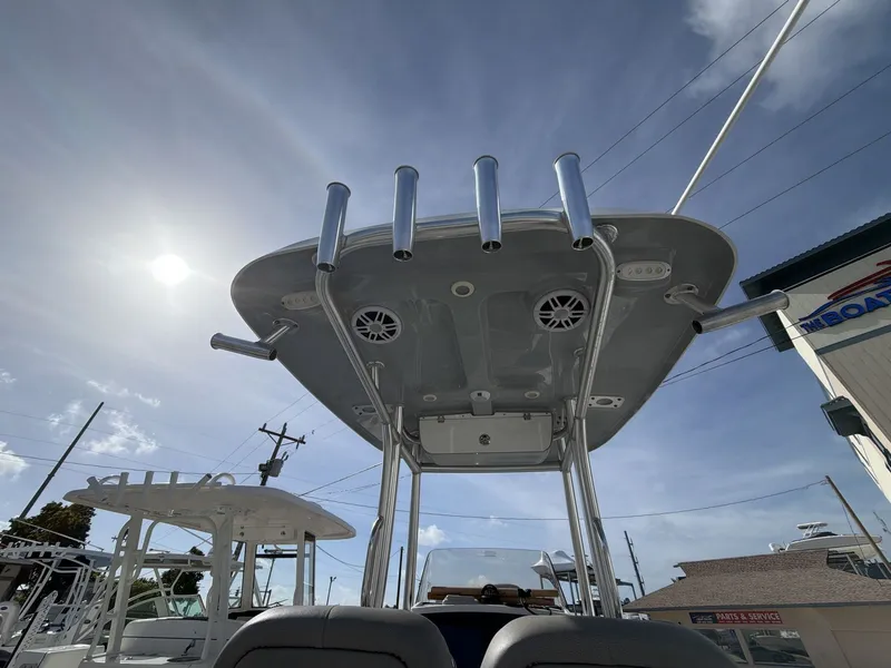 Slide: The Image of 2024 Sportsman Masters 227 Bay Boat with T-top and fishing rod holders. - 3