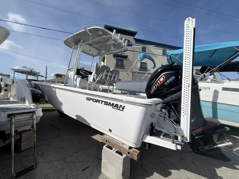 Slide: The Image of 2024 Sportsman Masters 227 Bay Boat on a parking lot. - 7