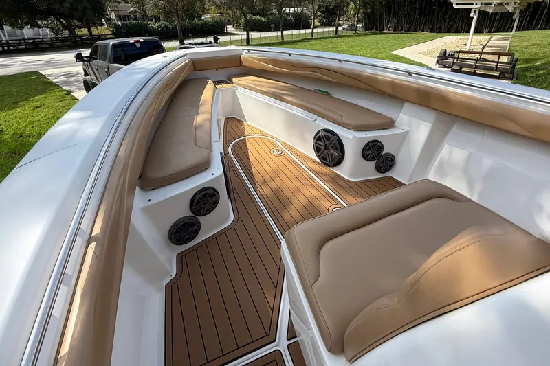 Slide: The Image of Luxurious 2007 Spectre 34 boat interior with tan seating and wood-style flooring. - 3