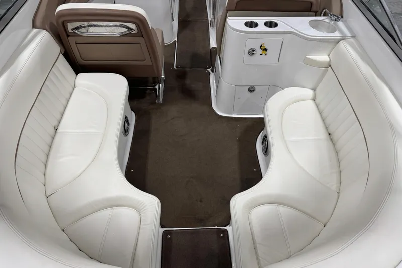 Slide: The Image of Interior of a 2007 Cobalt 282 boat with white seating and cup holders. - 11
