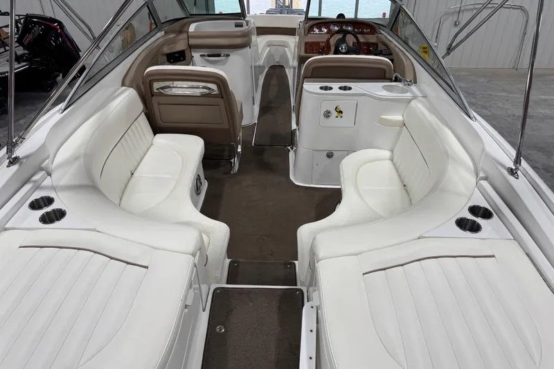 Slide: The Image of Luxurious interior of a 2007 Cobalt 282 boat with white seating and elegant design. - 12