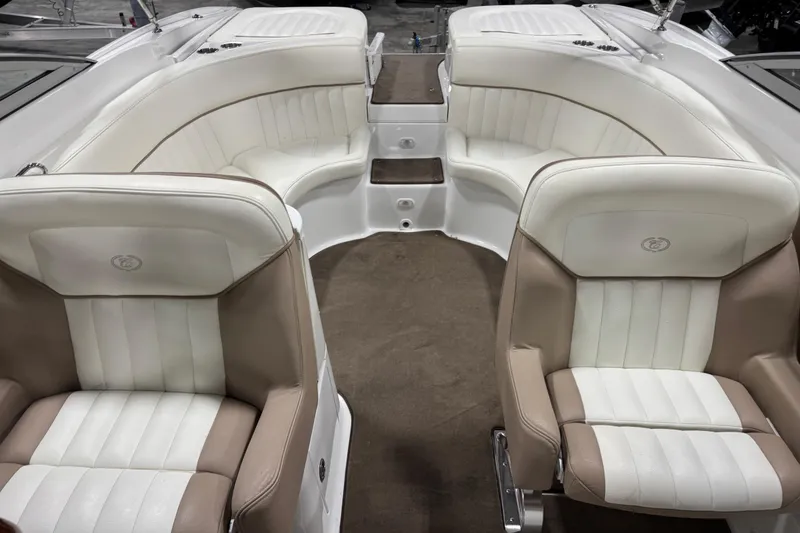 Slide: The Image of Luxurious interior of a 2007 Cobalt 282 boat with white and beige seating. - 7