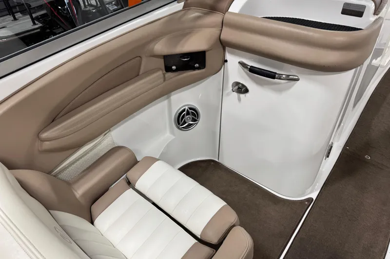 Slide: The Image of Interior of a 2007 Cobalt 282 boat, featuring beige and white seating. - 9