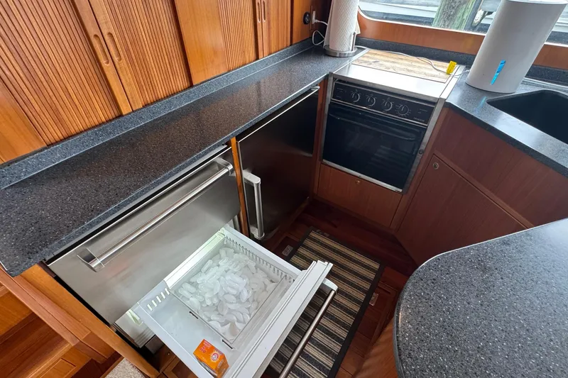 Slide: The Image of Galley kitchen in 2007 Jefferson Pilothouse 52 SE with ice drawer and stove. - 10