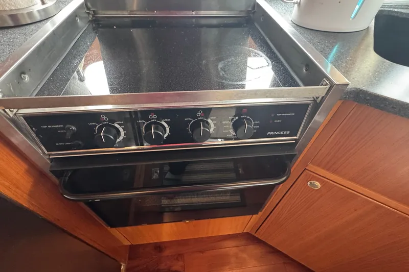 Slide: The Image of Stove and oven in 2007 Jefferson Pilothouse 52 SE yacht kitchen. - 11