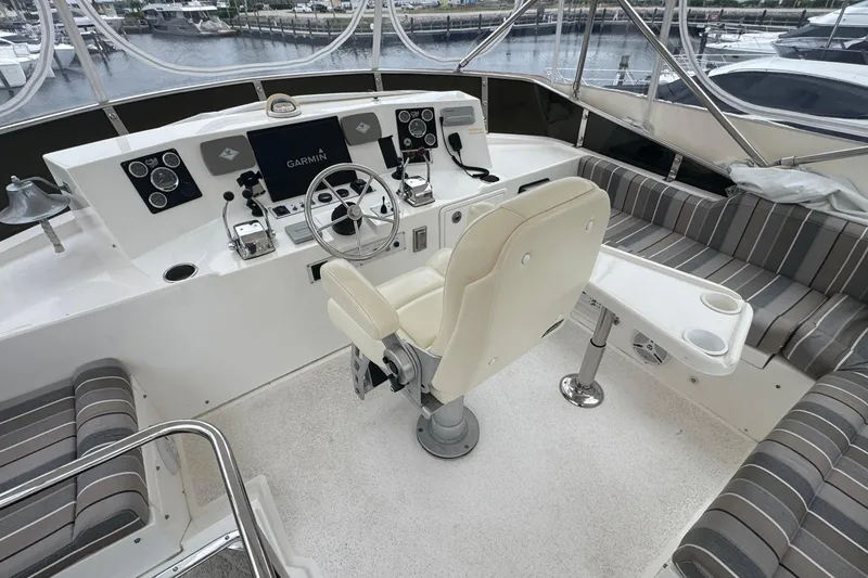 Slide: The Image of Pilothouse interior of 2007 Jefferson Pilothouse 52 SE with helm, seating, and navigation equipment. - 17