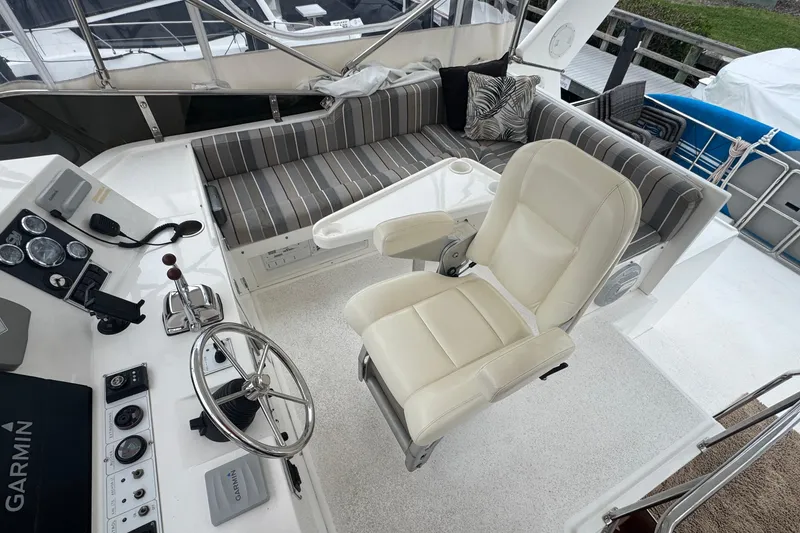Slide: The Image of Pilothouse interior of 2007 Jefferson Pilothouse 52 SE with helm and seating area. - 18