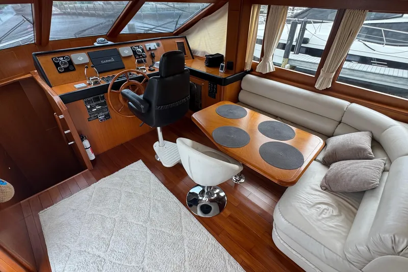 Slide: The Image of Pilothouse interior of 2007 Jefferson Pilothouse 52 SE with helm, seating, and table. - 22