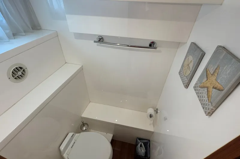 Slide: The Image of Bathroom interior of 2007 Jefferson Pilothouse 52 SE yacht, featuring modern fixtures and nautical decor. - 29