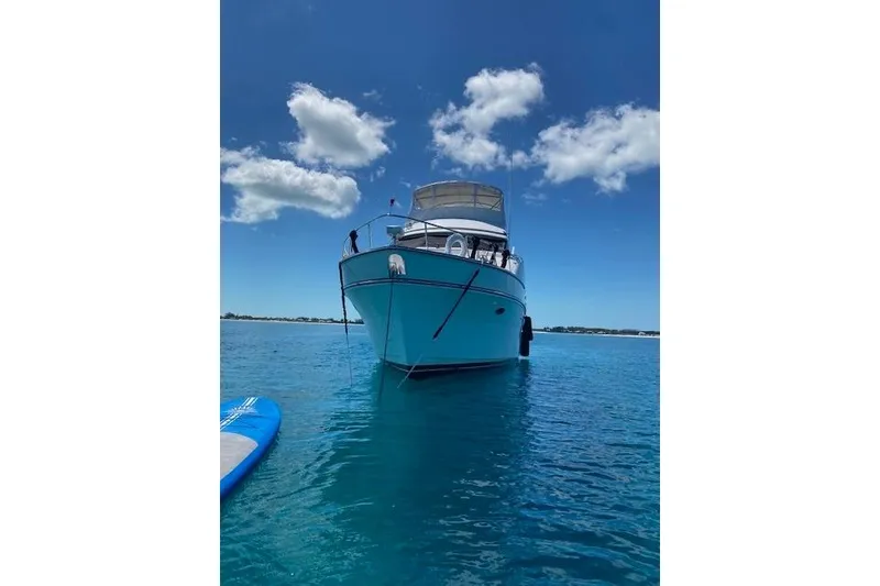 Slide: The Image of 2007 Jefferson Pilothouse 52 SE yacht on clear blue water under a bright sky. - 3