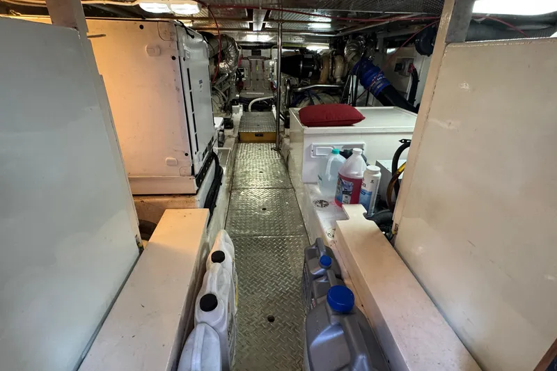 Slide: The Image of Engine room of a 2007 Jefferson Pilothouse 52 SE yacht, featuring equipment and storage. - 31