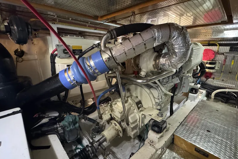 Slide: The Image of Engine room of a 2007 Jefferson Pilothouse 52 SE yacht, showcasing mechanical components. - 34