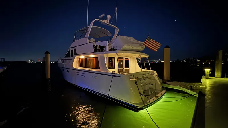 Slide: The Image of 2007 Jefferson Pilothouse 52 SE yacht docked at night. - 4