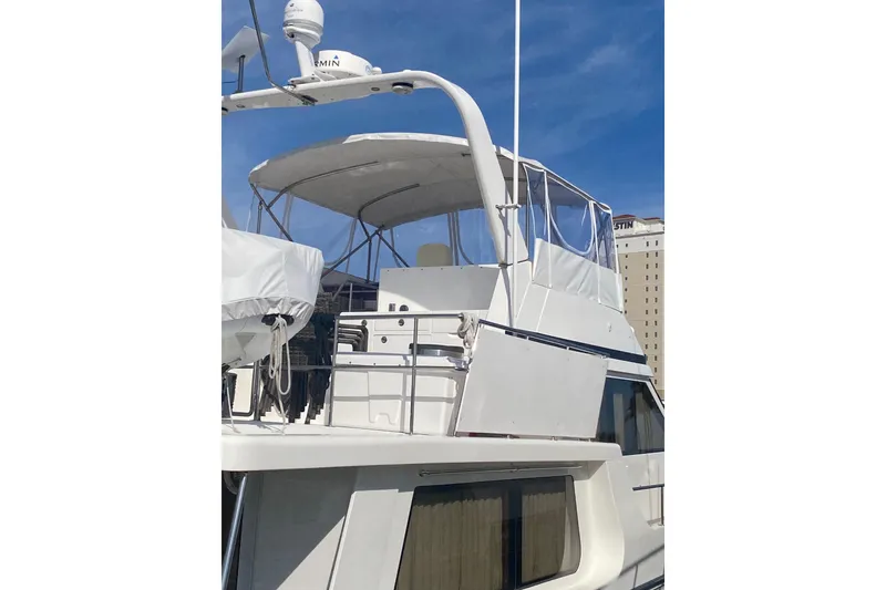 Slide: The Image of 2007 Jefferson Pilothouse 52 SE yacht with upper deck and radar equipment. - 42