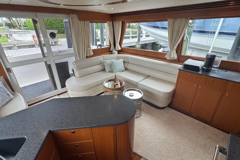 Slide: The Image of Luxurious interior of 2007 Jefferson Pilothouse 52 SE yacht with elegant seating and cabinetry. - 7