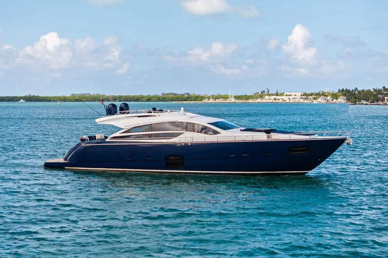 The Image of Luxurious 2013 Pershing 82 yacht cruising on serene blue waters. - 1