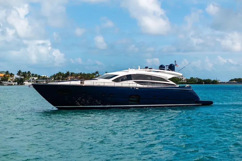 Slide: The Image of Luxury 2013 Pershing 82 yacht cruising on turquoise waters under a clear sky. - 10