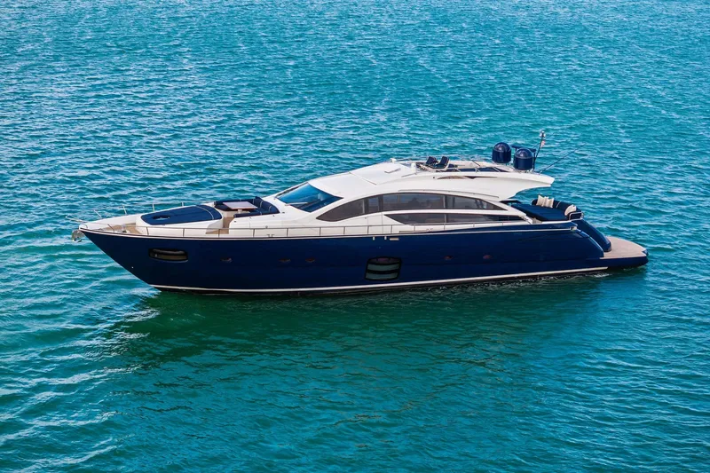 Slide: The Image of Luxurious 2013 Pershing 82 yacht cruising on clear blue waters. - 11