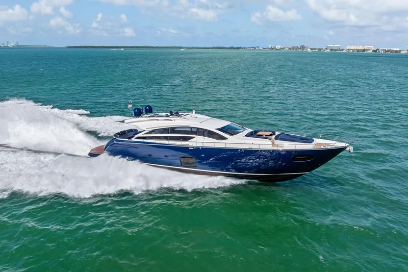 Slide: The Image of Luxurious 2013 Pershing 82 yacht cruising on open sea under clear skies. - 13