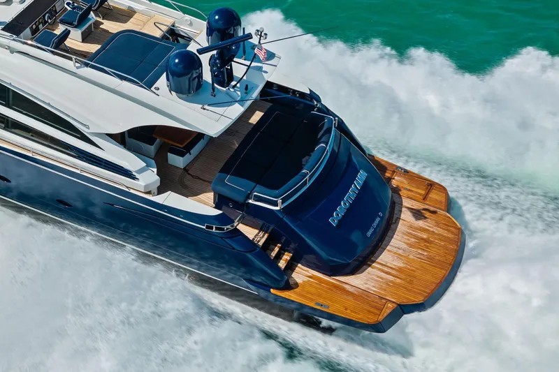 Slide: The Image of Luxury Pershing 82 yacht cruising through turquoise waters, showcasing sleek design and elegance. - 14