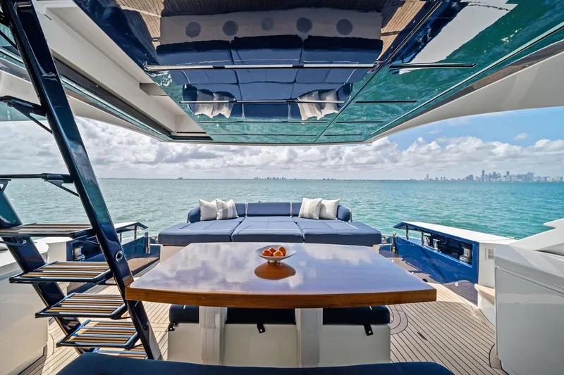 Slide: The Image of Luxurious 2013 Pershing 82 yacht deck with ocean view and elegant seating area. - 16