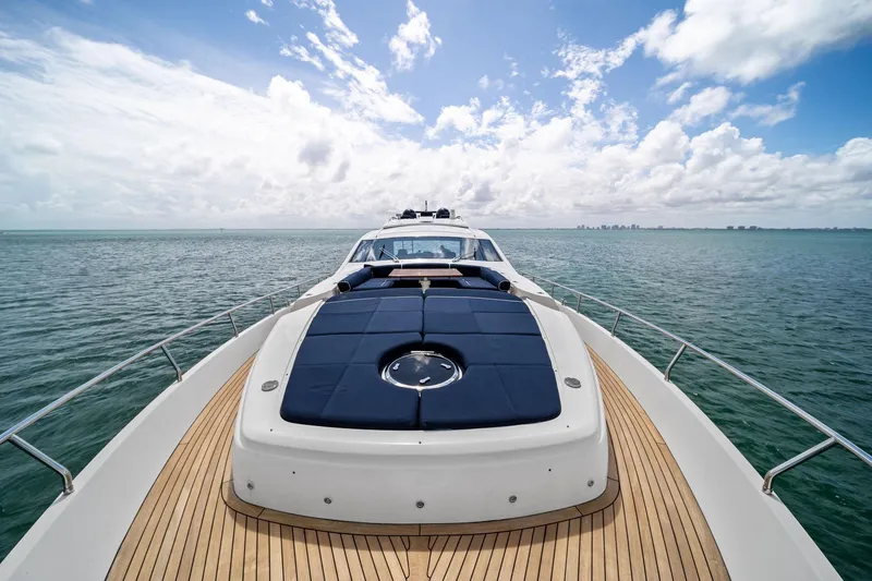 Slide: The Image of Luxurious 2013 Pershing 82 yacht cruising on open sea under a bright blue sky. - 19