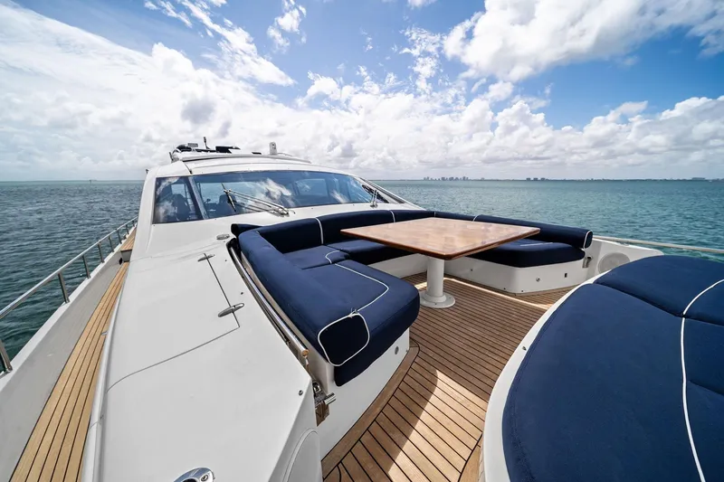 Slide: The Image of Luxurious 2013 Pershing 82 yacht with elegant deck seating and ocean view. - 20