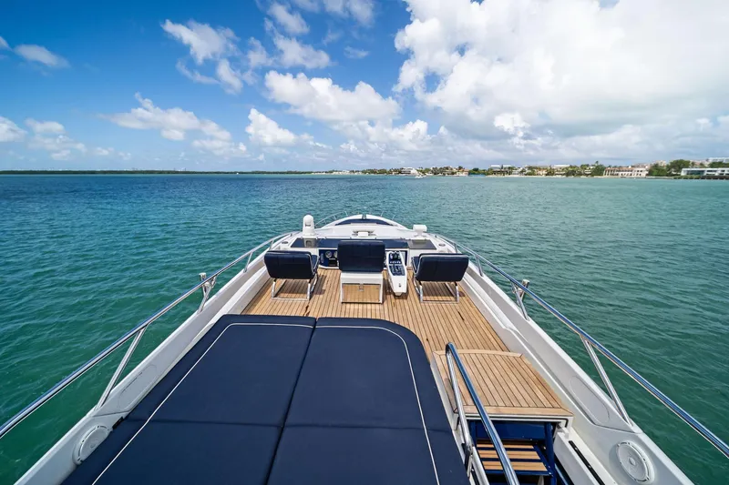 Slide: The Image of Luxurious 2013 Pershing 82 yacht deck with stunning ocean view and clear blue skies. - 26