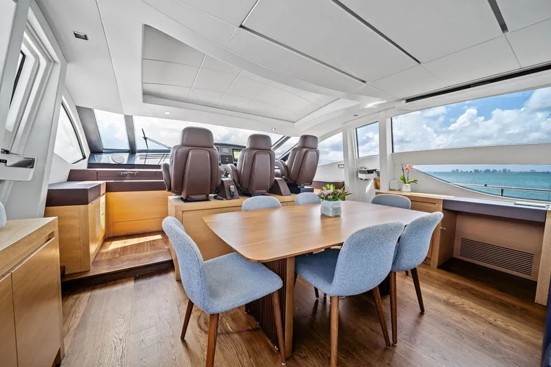 Slide: The Image of Luxurious interior of 2013 Pershing 82 yacht with elegant dining area and ocean view. - 28