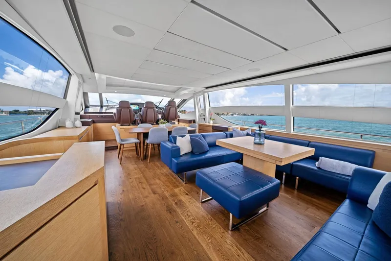 Slide: The Image of Luxurious interior of 2013 Pershing 82 yacht with blue seating and ocean view. - 29
