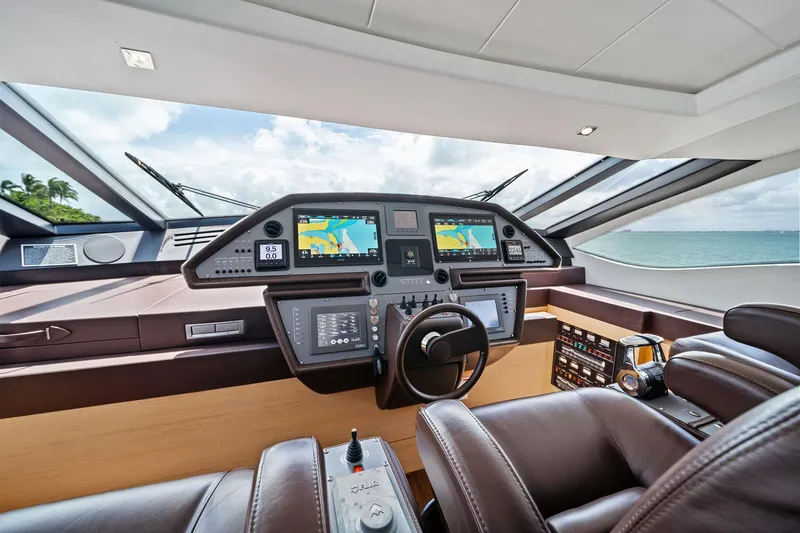 Slide: The Image of Luxurious 2013 Pershing 82 yacht cockpit with advanced navigation systems and leather seating. - 32