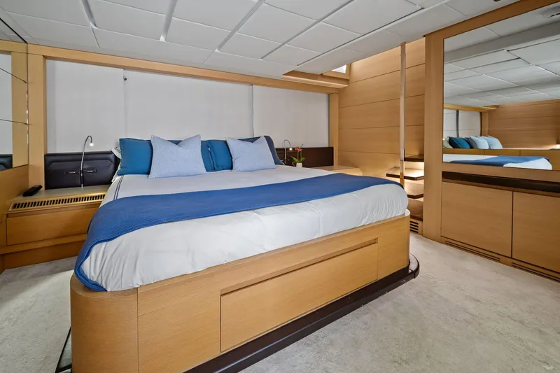 Slide: The Image of Luxurious bedroom interior on a 2013 Pershing 82 yacht, featuring modern design and elegant decor. - 36