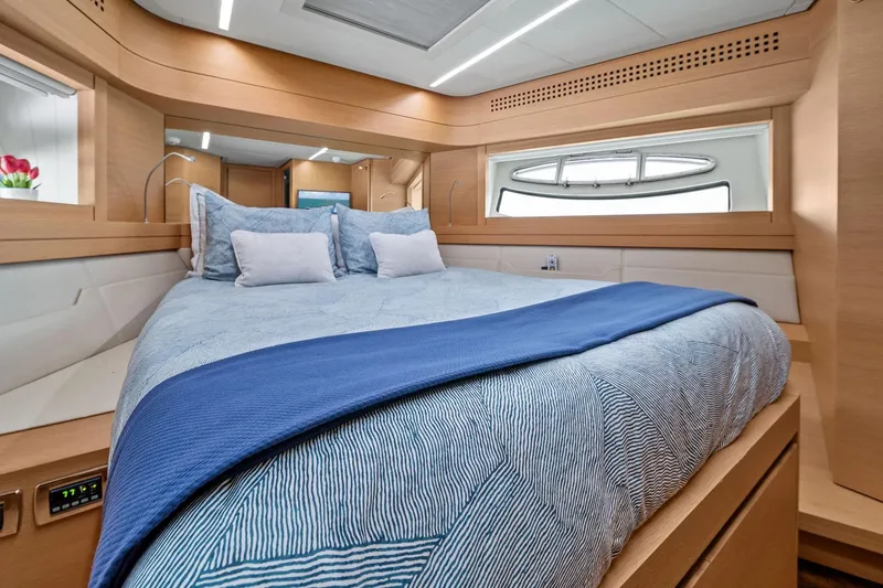 Slide: The Image of Luxurious bedroom interior of 2013 Pershing 82 yacht with modern design and cozy bedding. - 38