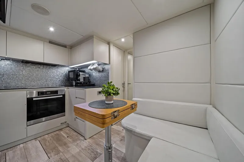 Slide: The Image of Luxurious 2013 Pershing 82 yacht interior with modern kitchen and cozy seating area. - 41