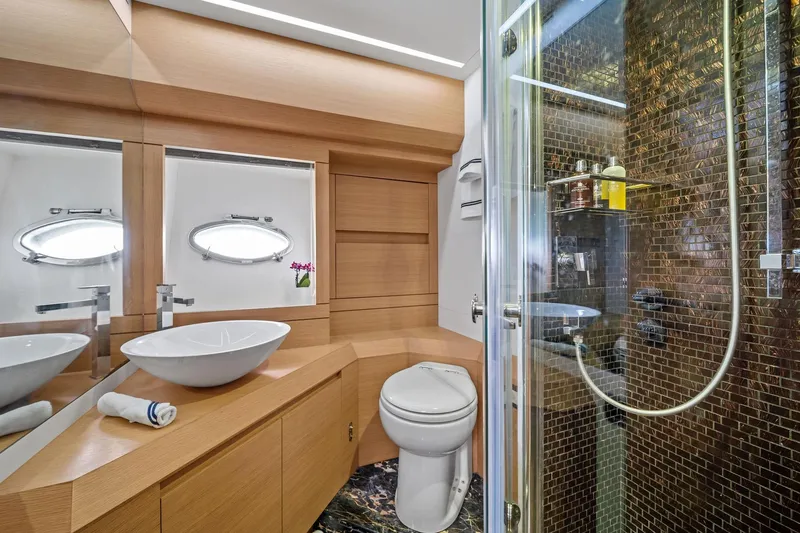 Slide: The Image of Luxurious bathroom on 2013 Pershing 82 yacht with modern fixtures and elegant design. - 43