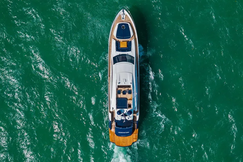 Slide: The Image of Aerial view of 2013 Pershing 82 yacht cruising in vibrant green waters. - 6
