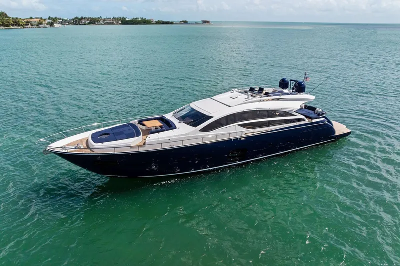 Slide: The Image of Luxurious 2013 Pershing 82 yacht cruising on clear blue waters. - 8