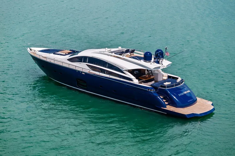 Slide: The Image of Luxurious 2013 Pershing 82 yacht cruising on clear turquoise waters. - 9
